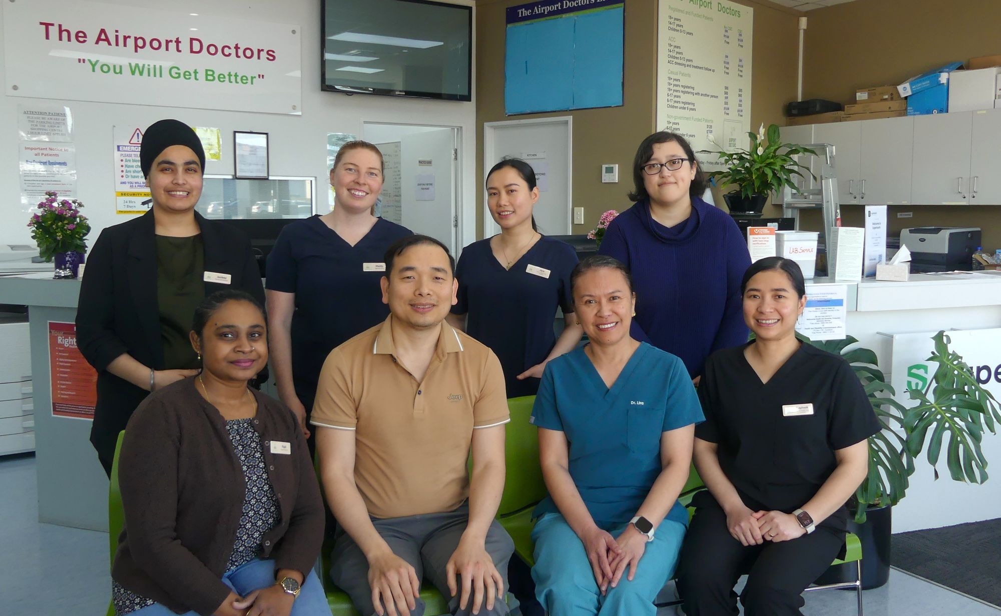 The Airport Lifestyle Doctors team smiling together in our reception